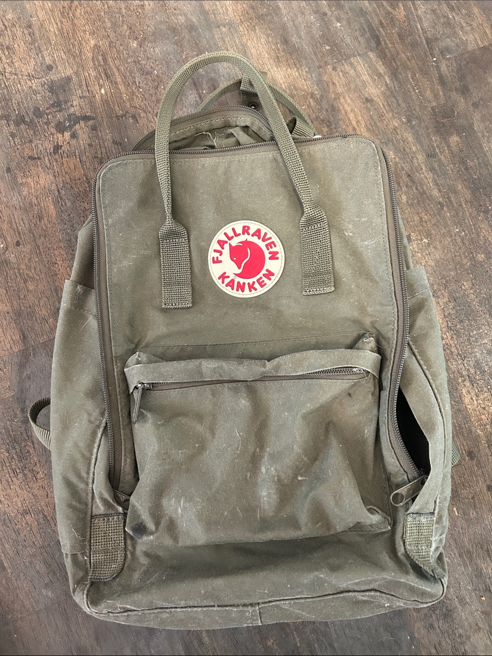 Fjallraven Kånken Backpack in Olive Green with Red Logo